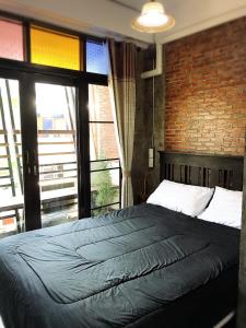 Postel nebo postele na pokoji v ubytování Lanna Hostel