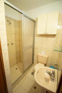 a bathroom with a shower and a toilet and a sink at Apartment in the Plaza de Armas Cusco in Cusco