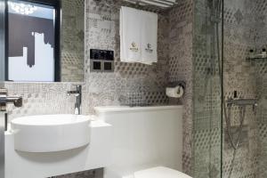 Kylpyhuone majoituspaikassa City Inn Macau