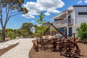 a statue of a tractor in front of a house at Carpe Mykonos - BRAND NEW HOME - bushland retreat in Margaret River Town