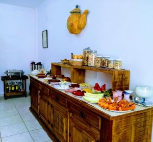 a kitchen counter with a bunch of food on it at Tiradentes Pousada Ramalhete in Tiradentes +74 photos