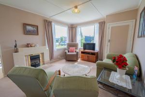 O zonă de relaxare la Rustlein Cottage - Te Anau Holiday Home