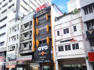 a building with a sign on the side of it at OYO 552 Hotel Kl Centre Point in Kuala Lumpur