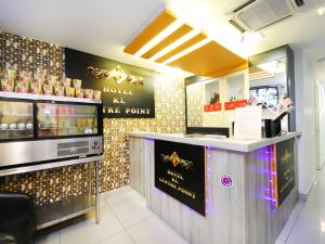 a fast food restaurant with a counter in the middle at OYO 552 Hotel Kl Centre Point in Kuala Lumpur