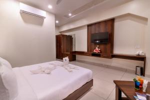 Voodi või voodid majutusasutuse Savitri Resort toas