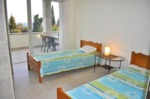 Posteľ alebo postele v izbe v ubytovaní House Lemoni, Apartment C - Pelekas, Corfu