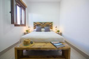 Posteľ alebo postele v izbe v ubytovaní Acogedoras casas Entre Dos Vientos, cerca de la playa