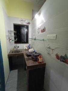 A kitchen or kitchenette at Jerone's Home Stay