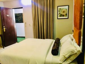 Ένα ή περισσότερα κρεβάτια σε δωμάτιο στο BW Starfire Hotel