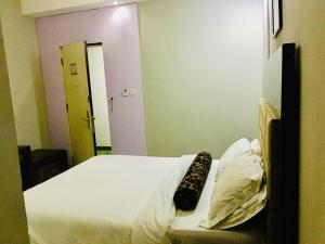 Ένα ή περισσότερα κρεβάτια σε δωμάτιο στο BW Starfire Hotel