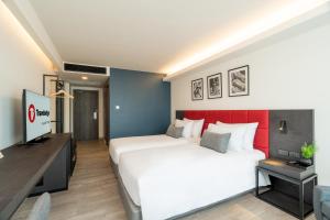 Llit o llits en una habitació de Travelodge Phuket Town