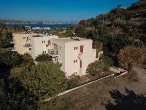 an aerial view of a white house on a hill at SINI Apartments 3 in Kefalos