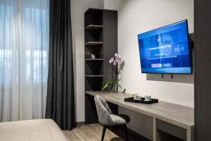 TV a/nebo společenská místnost v ubytování Corso 84 Luxury Suites