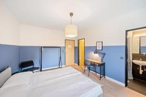 Becozy Self Check-in Pop-Up Hotel Baselにあるベッド