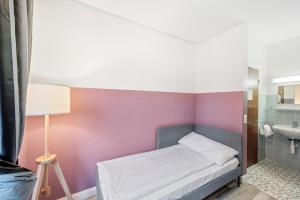Becozy Self Check-in Pop-Up Hotel Baselにあるベッド