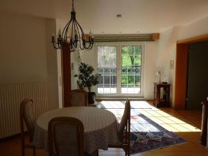 a dining room with a table and a window at Ferienwohnung Natur pur in Bad Pyrmont +5 photos