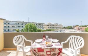 a table and chairs on a balcony with a view of a building at Residence Ionian Gallipoli in Gallipoli +21 photos