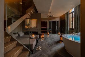 a bathroom with a staircase and a bath tub at Palazzo Veneziano - Venice Collection in Venice