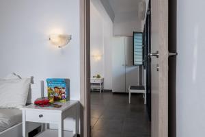 A television and/or entertainment centre at Rivari Santorini Hotel