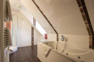 Koupelna v ubytování Ida's Hus + 11 fotografií