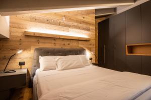 En eller flere senge i et værelse på CASA VACANZE RANUNCOLO 6