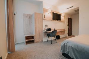 O bucătărie sau chicinetă la Hôtel Concorde