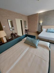 Postel nebo postele na pokoji v ubytování Hotel Joseph