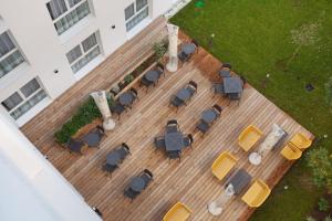 an overhead view of a patio with chairs and tables at Appart Hotel Odalys City Toulouse Centre Compans Caffarelli in Toulouse