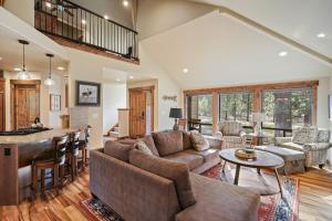 a living room with a couch and a table at 3 Tumalo with Wood Burning Fireplace in Sunriver