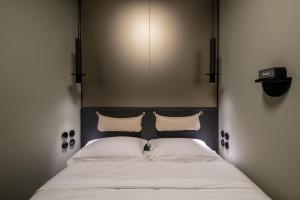 Posteľ alebo postele v izbe v ubytovaní 72 AD Suites