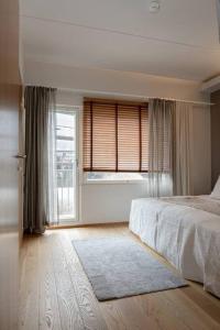 Ένα ή περισσότερα κρεβάτια σε δωμάτιο στο Tahko SPA Luxury Suite Orange B5 with Mountain View