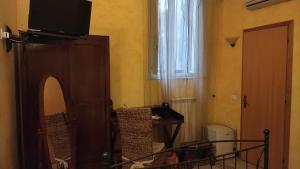 TV a/nebo společenská místnost v ubytování Palazzo Aprile