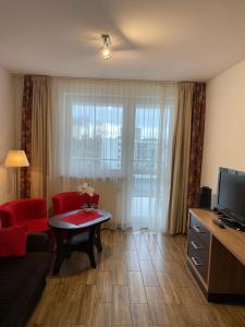 Televízia a/alebo spoločenská miestnosť v ubytovaní Apartament 454 w hotelu Diva
