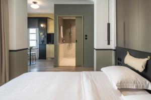 Posteľ alebo postele v izbe v ubytovaní 72 AD Suites