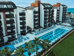 an aerial view of a resort with a swimming pool at Grand Uysal Beach & Spa Hotel in Alanya