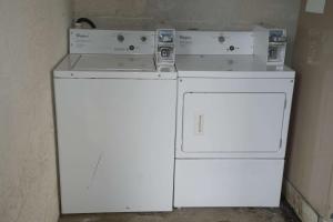 two washing machines sitting next to each other at Days Inn by Wyndham Kodak/Sevierville Intrstate SmokeyMntns in Kodak
