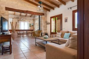 a living room with a couch and a table at Alcudiola in Santa Margalida