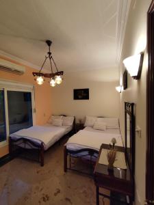 Ένα ή περισσότερα κρεβάτια σε δωμάτιο στο Villa Rayan