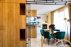 a kitchen and dining room with a table and chairs at CASA ARTA in Burgas