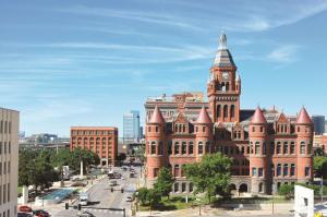 a large red brick building with a clock tower at Holiday Inn Express - Dallas Downtown, an IHG Hotel in Dallas