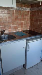 a kitchen with a sink and a counter top at Studio - Marina 4 - 17 allée des Pinons - 3-2 in Saint-Jean-de-Monts