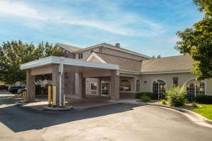 a house with a parking lot in front of it at Comfort Inn Lehi - Thanksgiving Point Area in Lehi