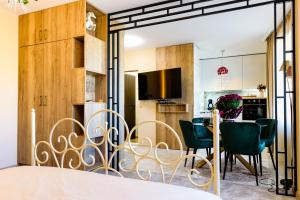 a kitchen and dining room with a table and chairs at CASA ARTA in Burgas City