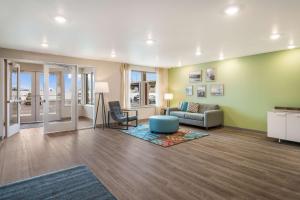 a living room with a couch and a chair at WoodSpring Suites Missoula in Missoula