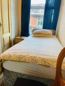 a small bedroom with a bed with a window at The Roadhouse Hotel in Carlisle