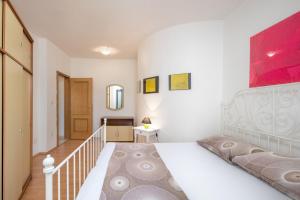 Postel nebo postele na pokoji v ubytování Apartments Lapida