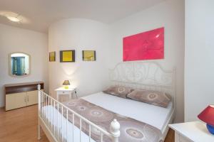 Postel nebo postele na pokoji v ubytování Apartments Lapida