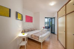 Postel nebo postele na pokoji v ubytování Apartments Lapida