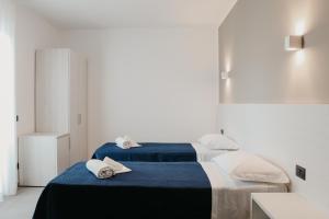 Ліжко або ліжка в номері Residence Vazzieri