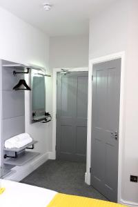 a bathroom with a shower and a glass door at The White House in Peterlee